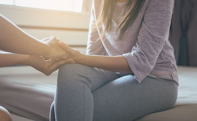 close up photo of two people holding hands